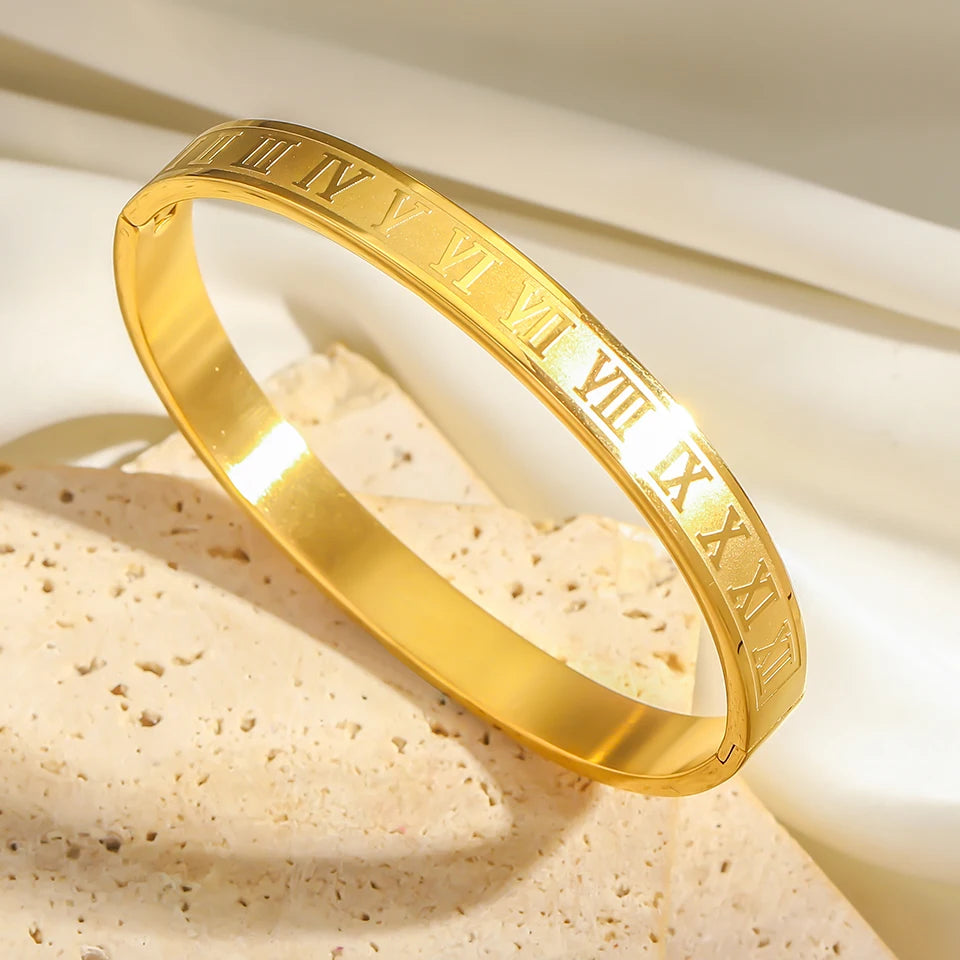 Roman Numeral Stainless Bracelet 2pcs Set, gold bangle with engraved Roman numerals on a light background.